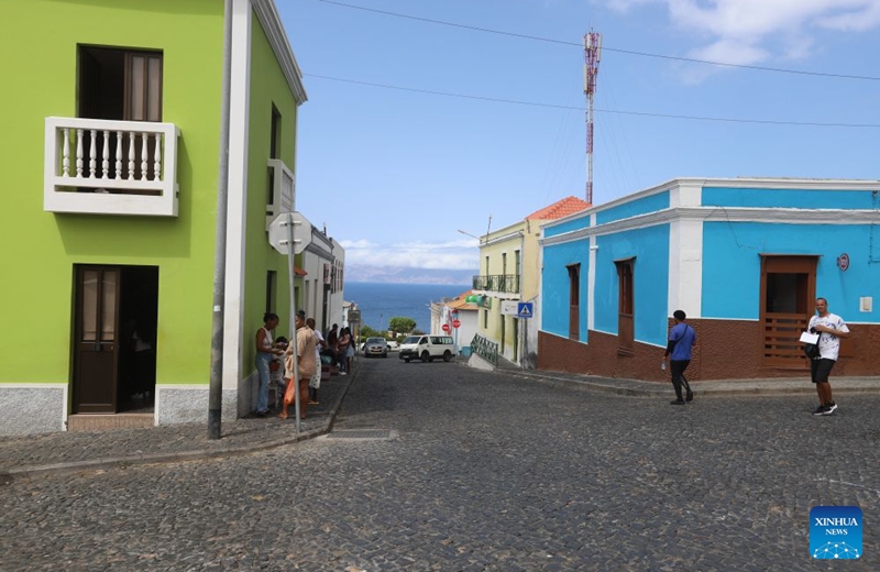This photo taken on Sept. 11, 2026 shows a city view of Sao Filipe, Fogo Island, Cabo Verde. Fogo Island is located in the southern part of the Cabo Verde archipelago. Shaped by volcanic activity, its landscape is characterized by a volcano, black lava and volcanic soils. Sao Filipe, the island's main city, is built on slopes overlooking the Atlantic, with streets lined with brightly colored buildings. (Photo by Elton Monteiro/Xinhua)