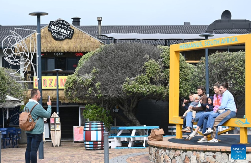 Tourists take photos at a popular spot in Hermanus, South Africa, Sept. 11, 2026. Hermanus is a famous seaside town in South Africa's Western Cape Province, renowned as one of the world's best whale-watching destinations. (Xinhua/Deng Bingxue)
