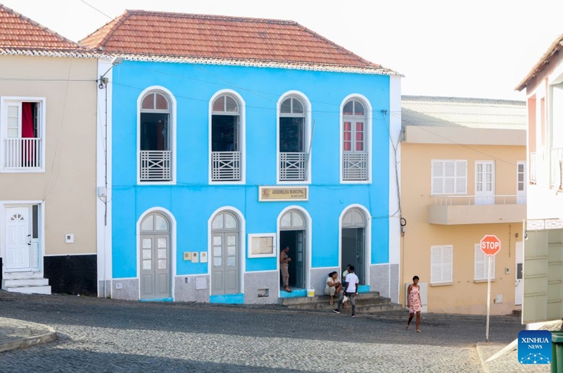 This photo taken on Sept. 9, 2026 shows a city view of Sao Filipe, Fogo Island, Cabo Verde. Fogo Island is located in the southern part of the Cabo Verde archipelago. Shaped by volcanic activity, its landscape is characterized by a volcano, black lava and volcanic soils. Sao Filipe, the island's main city, is built on slopes overlooking the Atlantic, with streets lined with brightly colored buildings. (Photo by Elton Monteiro/Xinhua)