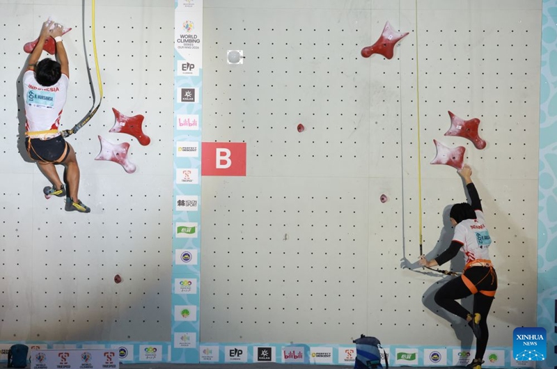 Raharjati Nursamsa (L) and Rajiah Sallsabillah of Indonesia compete during the mixed speed relay at the World Climbing Series Guiyang 2026 in Guiyang, southwest China's Guizhou Province, Sept. 12, 2026. (Xinhua/Liu Xu)