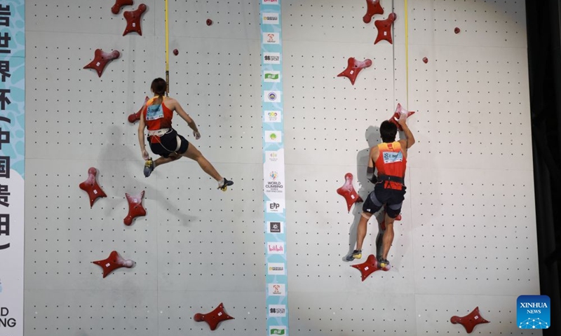 Zhou Ziyu (R) and Zhang Mengli of China compete during the mixed speed relay at the World Climbing Series Guiyang 2026 in Guiyang, southwest China's Guizhou Province, Sept. 12, 2026. (Xinhua/Liu Xu)