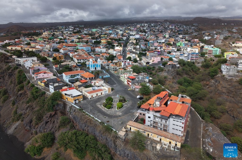 An aerial drone photo taken on Sept. 11, 2026 shows a view of Sao Filipe, Fogo Island, Cabo Verde. Fogo Island is located in the southern part of the Cabo Verde archipelago. Shaped by volcanic activity, its landscape is characterized by a volcano, black lava and volcanic soils. Sao Filipe, the island's main city, is built on slopes overlooking the Atlantic, with streets lined with brightly colored buildings. (Photo by Elton Monteiro/Xinhua)
