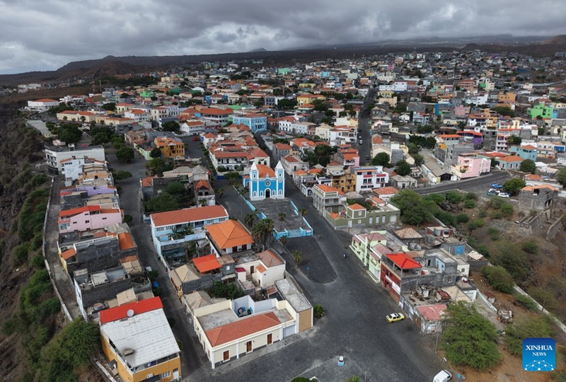 An aerial drone photo taken on Sept. 11, 2026 shows a view of Sao Filipe, Fogo Island, Cabo Verde. Fogo Island is located in the southern part of the Cabo Verde archipelago. Shaped by volcanic activity, its landscape is characterized by a volcano, black lava and volcanic soils. Sao Filipe, the island's main city, is built on slopes overlooking the Atlantic, with streets lined with brightly colored buildings. (Photo by Elton Monteiro/Xinhua)