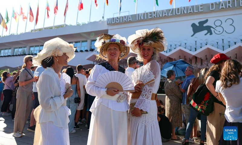Spectators wait for the red carpet of the 83rd Venice International Film Festival closing ceremony in Venice, Italy, Sept. 12, 2026. Photo: Xinhua