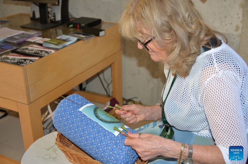 A woman makes lace at the 30th Lepoglava International Lace Festival in Lepoglava, Croatia on Sept. 12, 2026. The 30th Lepoglava International Lace Festival opened on Friday in the northern Croatian town of Lepoglava. (Xinhua/Ma Zhen)