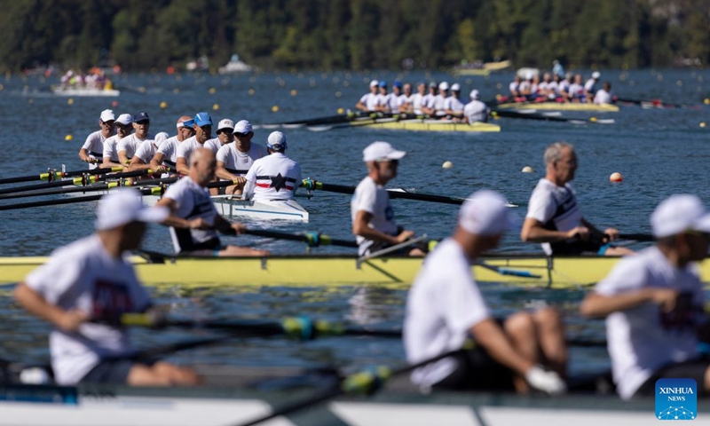 Rowers wait to race on Lake Bled during the 2026 World Rowing Masters Regatta Bled in Bled, Slovenia, Sept. 12, 2026. (Photo by Zeljko Stevanic/Xinhua)