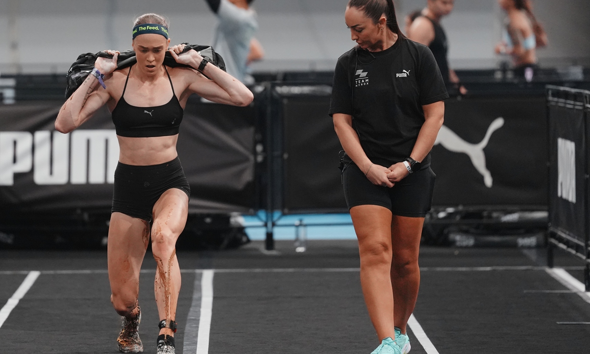 Australian athlete Joanna Wietrzyk (right) competes in the women's elite race at the Hyrox event while suffering bowel incontinence on September 12, 2026 in Beijing. Photo: VCG
