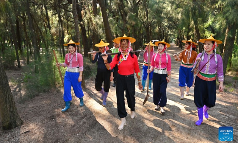 Chen Liying (C, front) and her fellow rangers walk among casuarina trees at the Xiaozuo Forest Farm in Hui'an County, southeast China's Fujian Province, Sept. 9, 2026. Early autumn sees millions of casuarina trees swaying gently by the wind at Xiaozuo Forest Farm in Hui'an County. Behind this lush forest lies sixty years of perseverance by female rangers.