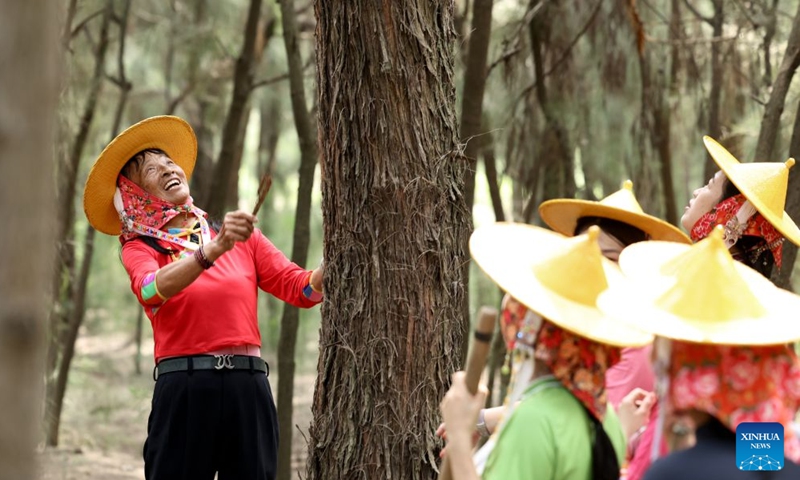 Chen Liying (1st L) shares her tree-planting stories with newly recruited female forest rangers at the Xiaozuo Forest Farm in Hui'an County, southeast China's Fujian Province, Sept. 9, 2026. (Xinhua/Jiang Kehong)