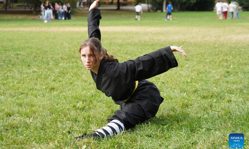Pinter-Kruncz Luna, a Hungarian Wushu enthusiast, practices Shaolin Kung Fu during the 6th Family and Friends Gathering of the Hungarian Chan Wu Federation on Margaret Island in Budapest, Hungary, Sept. 13, 2026. (Xinhua/Chen Hao)

