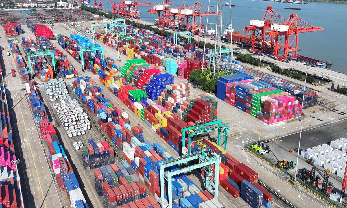 A container terminal in the Zhangjiagang port area of Suzhou Port, in East China's Jiangsu Province, is bustling with trucks and ships, with cargo loading and unloading operations busy and orderly on September 15, 2026. In the first eight months of this year, Suzhou's foreign trade reached 2.6 trillion yuan ($387.3 billion), up 47.9 percent year-on-year. Photo: VCG