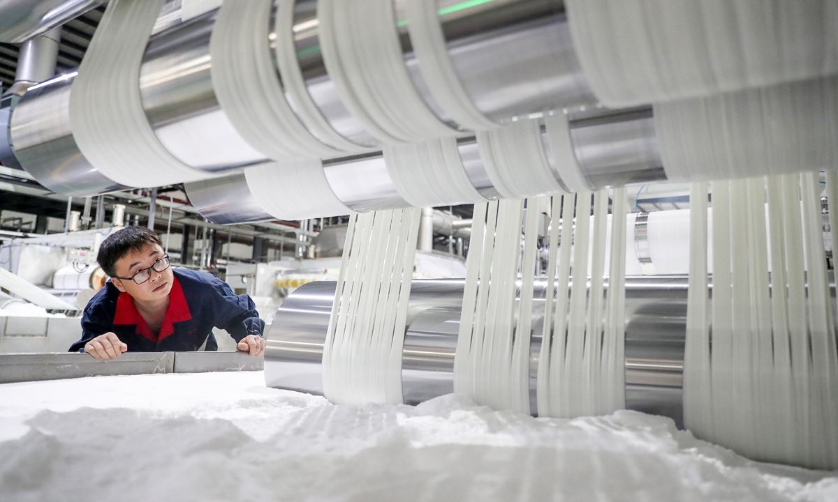 A worker inspects export products at a new materials factory in the Guang'an Economic and Technological Development Zone, Southwest China's Sichuan Province, on September 15, 2026. The zone has boosted policy support, customs efficiency and foreign trade cooperation to promote trade growth. Photo: VCG