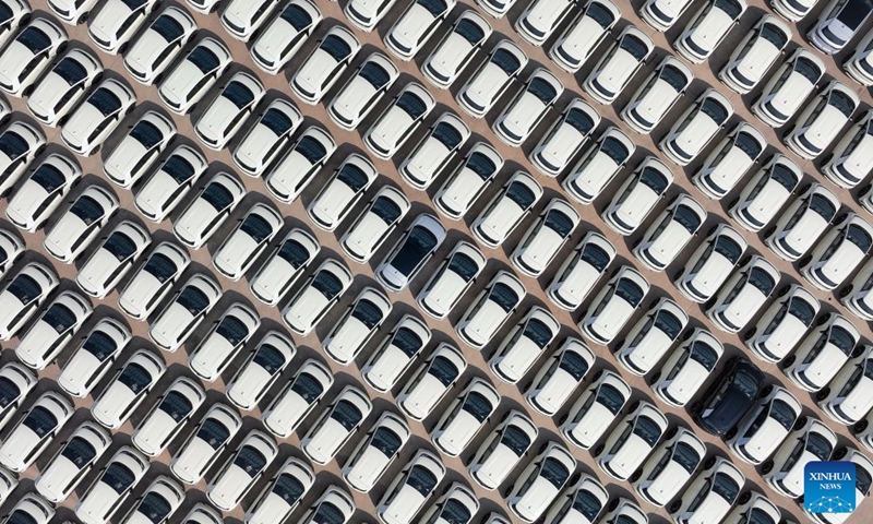 This aerial drone photo taken on Sept. 9, 2026 shows vehicles to be exported at the BYD Fuzhou base in Fuzhou, east China's Jiangxi Province. In the workshop of Chinese automaker BYD's Fuzhou base in Jiangxi, stamping, welding, painting and final assembly processes operate efficiently. Industrial robots and automated guided vehicles work in coordination, achieving full-process digital control. (Xinhua/Wan Xiang)


