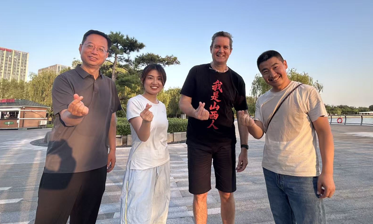 Andy (second from right) poses for a picture with his friends at the Fenhe Park in Taiyuan, north China's Shanxi province. (Photo courtesy of Andy)Andy (second from right) poses for a picture with his friends at the Fenhe Park in Taiyuan, north China's Shanxi province. Photo: Courtesy of Andy
