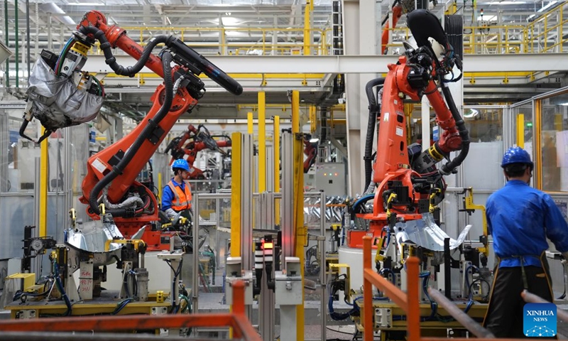 Robotic arms weld vehicle body components at the BYD Fuzhou base in Fuzhou, east China's Jiangxi Province, Sept. 9, 2026. In the workshop of Chinese automaker BYD's Fuzhou base in Jiangxi, stamping, welding, painting and final assembly processes operate efficiently. Industrial robots and automated guided vehicles work in coordination, achieving full-process digital control. (Xinhua/Wan Xiang)

