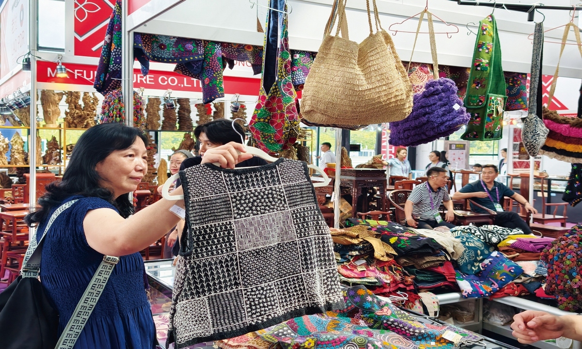 Visitors shop for Laotian specialty products at the exhibition area of the 23rd China-ASEAN Expo in Nanning, South China's Guangxi Zhuang Autonomous Region, on September 17, 2026. Photo: VCG