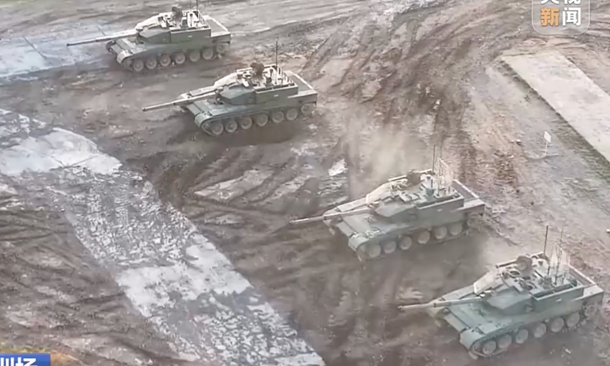Four Type 99B main battle tanks conduct live-fire drill Photo: Screenshot of CCTV News