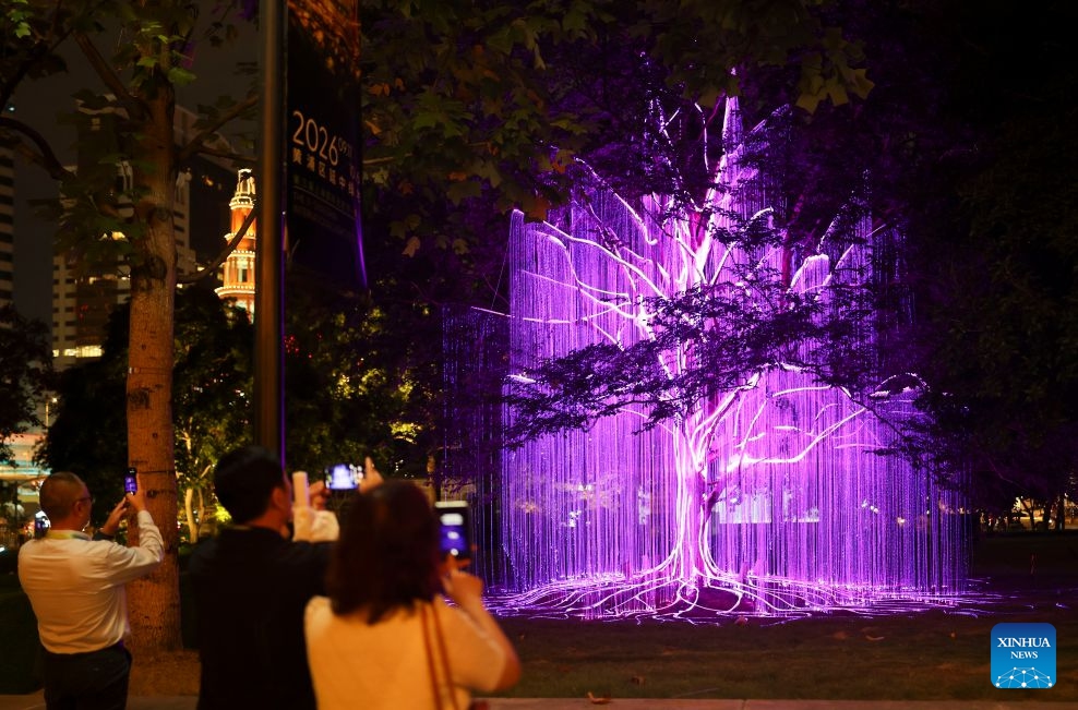 People enjoy a light show during the 3rd Shining Shanghai festival in Shanghai, east China, Sept. 17, 2026. The opening ceremony of the festival was held here on Thursday. The festival with one main venue and 16 sub-venues features 158 theme activities of shining feast. (Photo: Xinhua)