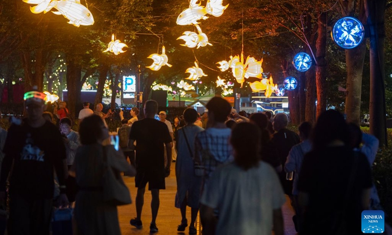 People enjoy a light show during the 3rd Shining Shanghai festival in Shanghai, east China, Sept. 17, 2026. The opening ceremony of the festival was held here on Thursday. The festival with one main venue and 16 sub-venues features 158 theme activities of shining feast. (Photo: Xinhua)
