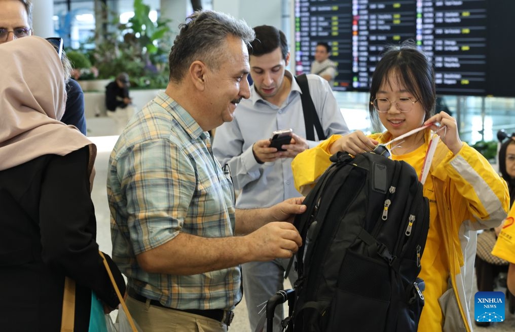 A volunteer helps a member of Iranian delegation for the 48th WorldSkills Competition attach a bag tag upon his arrival at Shanghai Pudong International Airport in Shanghai, east China, Sept. 17, 2026. The 48th WorldSkills Competition is scheduled to take place from September 22 to 27 in Shanghai. (Photo: Xinhua)