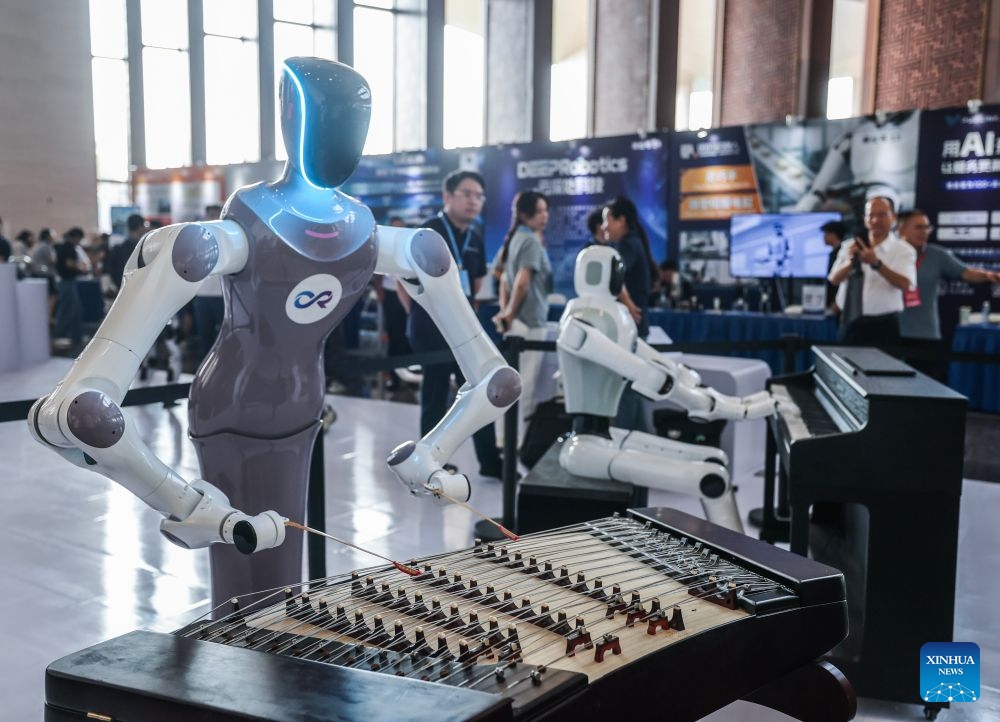Robots play musical instruments during the 9th China Robotop Summit in Hangzhou, east China's Zhejiang Province, Sept. 17, 2026. This summit kicked off at Hangzhou Future Sci-Tech City here on Thursday. Themed Smart Connectivity for a New Ecosystem, Empowering All Scenarios: The Intelligent and Qualitative Transformation in the 'Robot+' Era, the event served as a premier platform for academic exchange, industrial matchmaking, and exhibition within the robotics sector. (Photo: Xinhua)