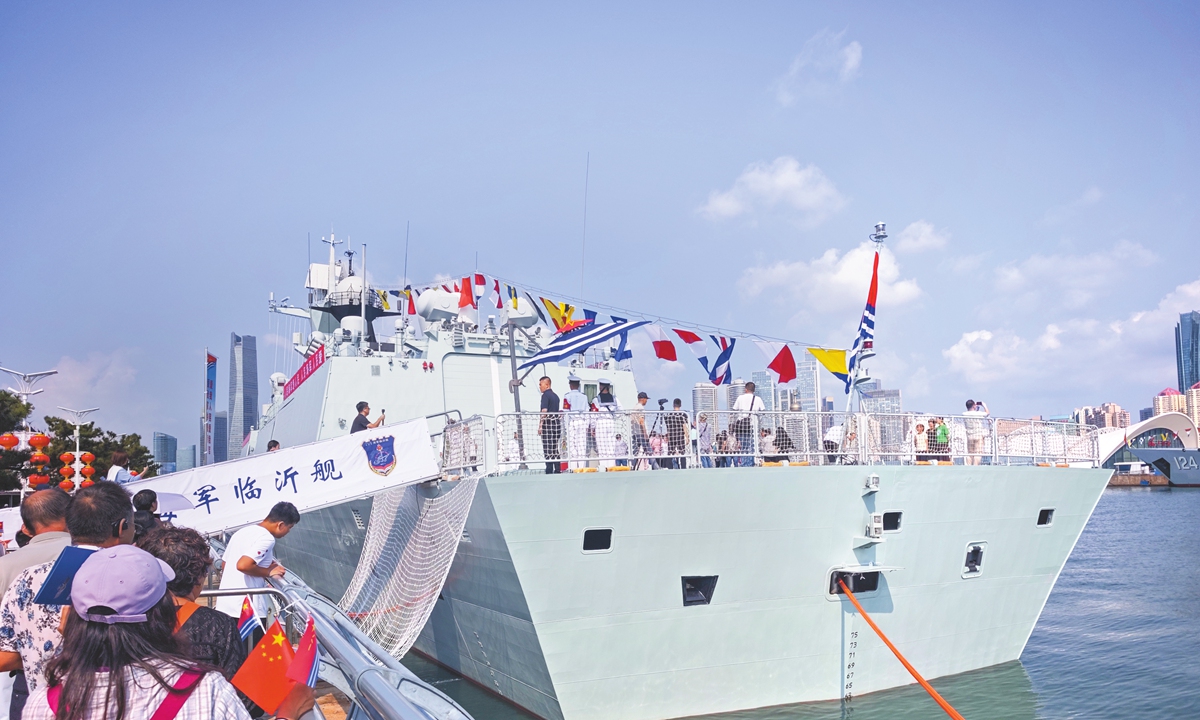 The PLA Navy's Northern Theater Command holds an open-day event at the Qingdao Olympic Sailing Center Wharf during a monthlong national defense education campaign. Naval vessels are dressed overall and open to the public on September 19, 2026. Photo: VCG
