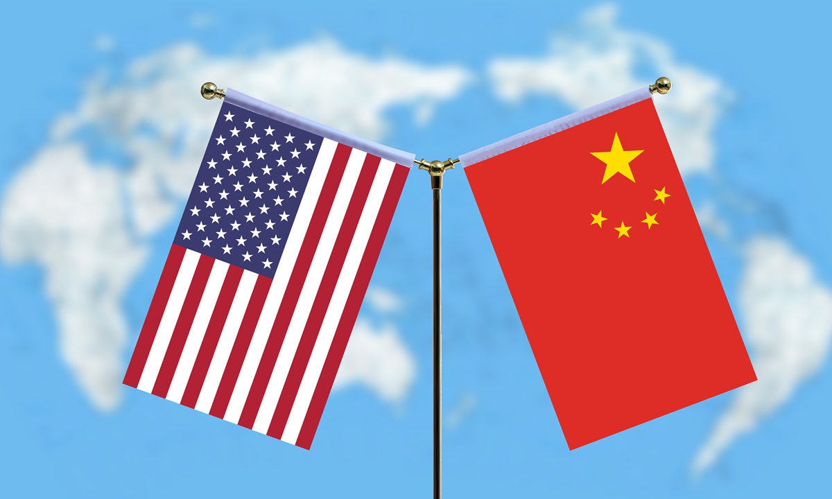 Chinese and US flags Photo: VCG