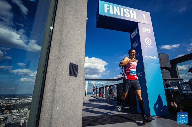 A runner crosses the finish line during the fifth edition of the Run Up Varso Tower stair-climbing race in Warsaw, Poland, Sept. 19, 2026. The event was held at Varso Tower in Warsaw on Saturday, with runners climbing almost 1,400 stairs on their way to the finish line located on the Highline Warsaw observation deck. (Photo by Jaap Arriens/Xinhua)