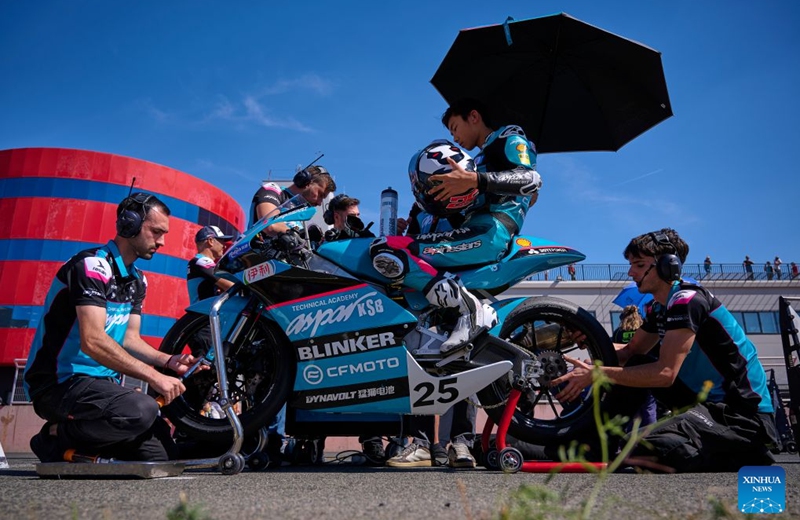 CFMOTO Aspar's rider Sun Shengbo (2nd R) of China prepares before the race 1 of the ESBK Talent category at the 2026 Spanish Superbike Championship Navarra in Navarra, Spain, Sept. 19, 2026. Photo: Xinhua