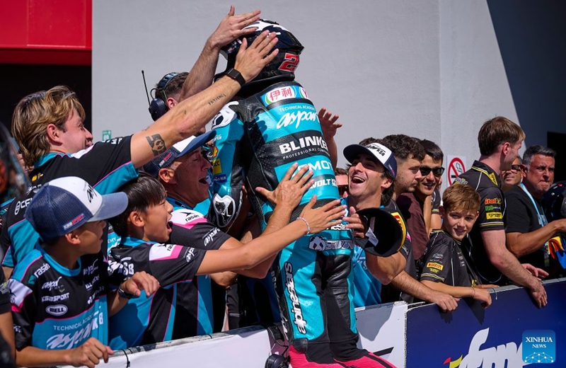 CFMOTO Aspar's rider Sun Shengbo (C) of China celebrates with team members after winning the race 1 of the ESBK Talent category at the 2026 Spanish Superbike Championship Navarra in Navarra, Spain, Sept. 19, 2026. Photo: Xinhua