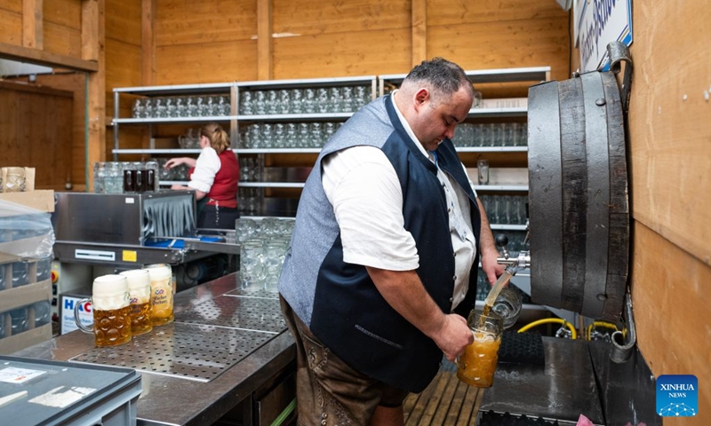A staff member prepares cups of beer at the Oktoberfest in Munich, Germany, Sept. 19, 2026. The 191st Oktoberfest, one of the largest folk festivals in Germany, opened on Saturday in Munich, with mayor Dominik Krause tapping the first barrel of beer as a tradition. This year's festival will last until Oct. 4. Photo: Xinhua