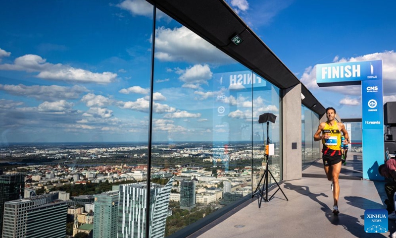 A runner crosses the finish line during the fifth edition of the Run Up Varso Tower stair-climbing race in Warsaw, Poland, Sept. 19, 2026. The event was held at Varso Tower in Warsaw on Saturday, with runners climbing almost 1,400 stairs on their way to the finish line located on the Highline Warsaw observation deck. (Photo by Jaap Arriens/Xinhua)