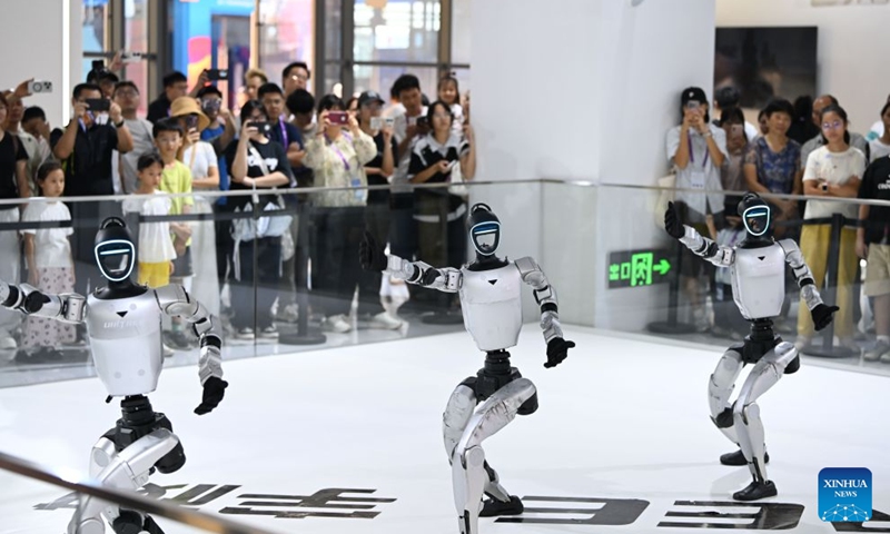 Humanoid robots dance at the 23rd China-ASEAN Expo in Nanning, south China's Guangxi Zhuang Autonomous Region, Sept. 19, 2026. Multiple intelligent robots were showcased and demonstrated a variety of skills at the China-ASEAN Expo. (Xinhua/Huang Xiaobang)