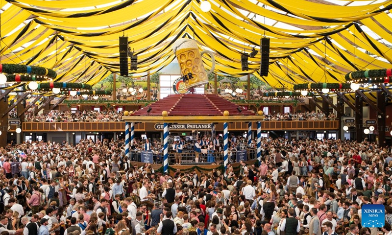 People enjoy beer at the Oktoberfest in Munich, Germany, Sept. 19, 2026. The 191st Oktoberfest, one of the largest folk festivals in Germany, opened on Saturday in Munich, with mayor Dominik Krause tapping the first barrel of beer as a tradition. This year's festival will last until Oct. 4. Photo: Xinhua