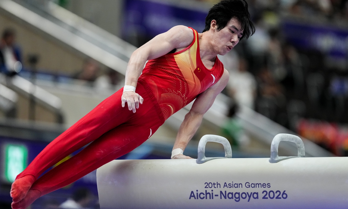 Zhang Boheng of China competes on the pommel horse during the Artistic Gymnastics Men's All-Around Final on day two of the 20th Asian Games Aichi-Nagoya at Nagoya City General Gymnasium Rainbow Hall in Nagoya, Aichi, Japan.  Photo: VCG