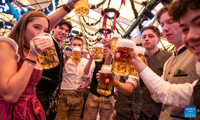 People enjoy beer at the Oktoberfest in Munich, Germany, Sept. 19, 2026. The 191st Oktoberfest, one of the largest folk festivals in Germany, opened on Saturday in Munich, with mayor Dominik Krause tapping the first barrel of beer as a tradition. This year's festival will last until Oct. 4. Photo: Xinhua