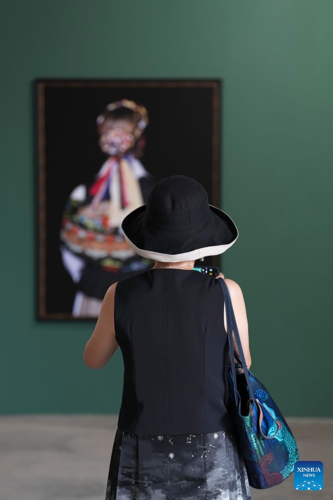 A woman visits the 26th Pingyao International Photography Festival (PIP) in Pingyao ancient town in Jinzhong, north China's Shanxi Province, Sept. 19, 2026. The 26th PIP kicked off here on Saturday, featuring works by more than 2,600 photographers from over 30 countries and regions. The event will run until Sept. 23. (Xinhua/Yang Chenguang)