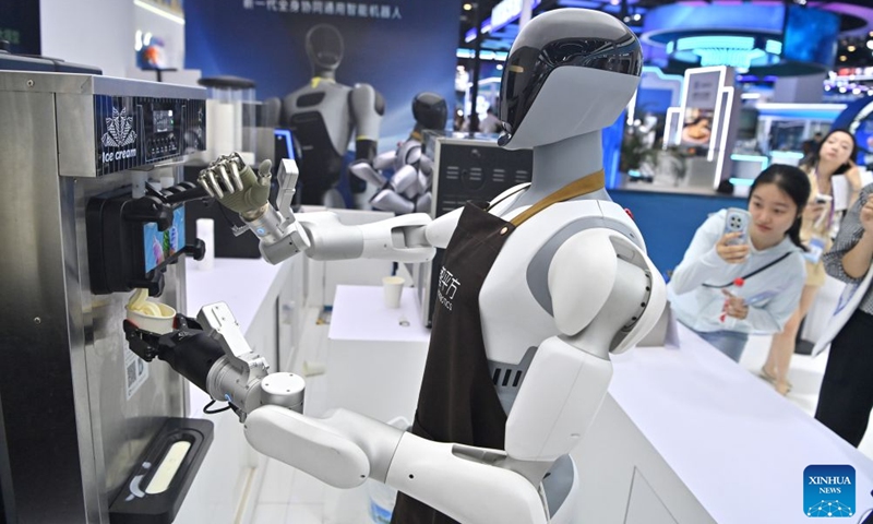 A humanoid robot sells ice-cream at the 23rd China-ASEAN Expo in Nanning, south China's Guangxi Zhuang Autonomous Region, Sept. 18, 2026. Multiple intelligent robots were showcased and demonstrated a variety of skills at the China-ASEAN Expo. (Xinhua/Zhou Hua)