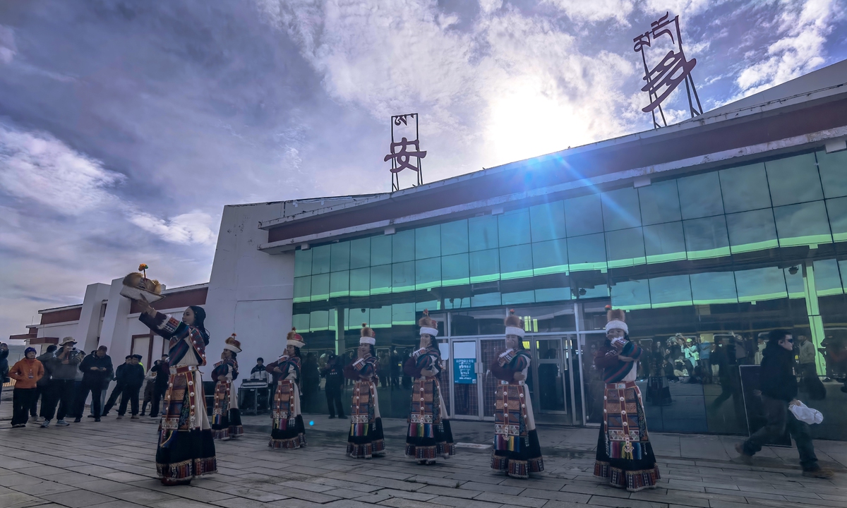 Local residents dance outside Amdo Railway Station in Xizang on June 27, 2026. Photo: VCG