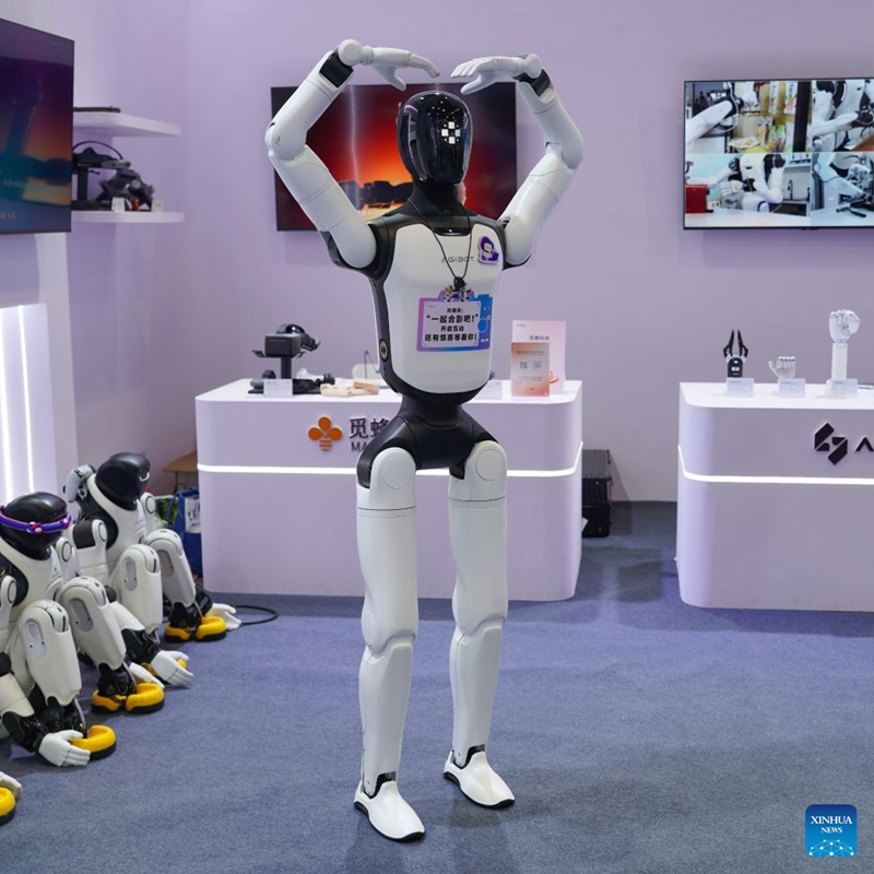 A robot gestures to visitors at the 23rd China-ASEAN Expo in Nanning, south China's Guangxi Zhuang Autonomous Region, Sept. 18, 2026. Multiple intelligent robots were showcased and demonstrated a variety of skills at the China-ASEAN Expo. (Xinhua/Shao Zedong)