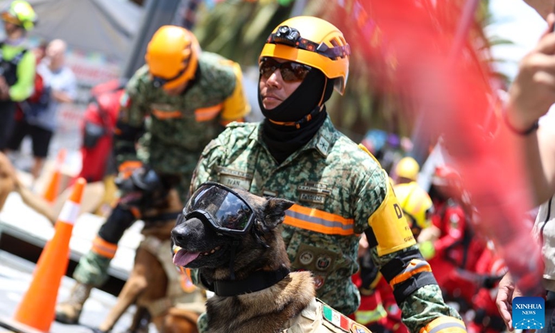 Emergency rescue team members and rescue dogs take part in the Second National Earthquake Drill 2026, in Mexico City, capital of Mexico, on Sept. 19, 2026. (Photo by Francisco Canedo/Xinhua)