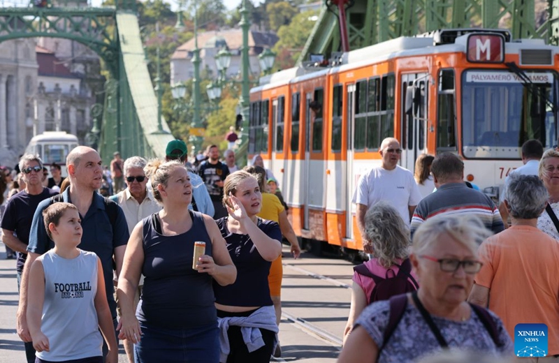 People attend a car-free weekend event in Budapest, Hungary, on Sept. 19, 2026. Budapest is holding a car-free weekend on Sept. 19-20 as part of European Mobility Week, promoting environmentally friendly and sustainable travel through public transport vehicle displays, cycling activities and family events. (Photo by Attila Volgyi/Xinhua)