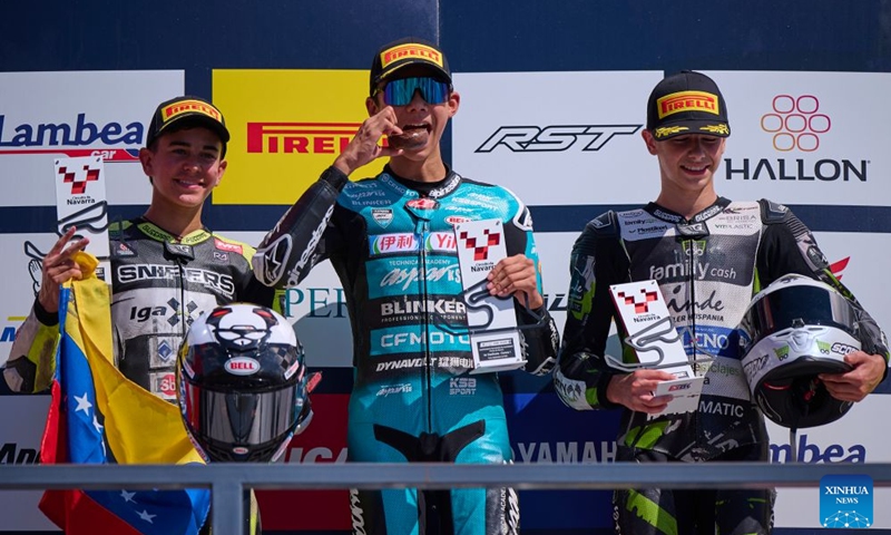 (L to R)Igax Team Snipers' rider Diego Gonzalez, CFMOTO Aspar Sun's rider Shengbo of China and Family Racing Team's rider Fermin Valero pose at the podium after the race 1 of the ESBK Talent category at the 2026 Spanish Superbike Championship Navarra in Navarra, Spain, Sept. 19, 2026. Photo: Xinhua