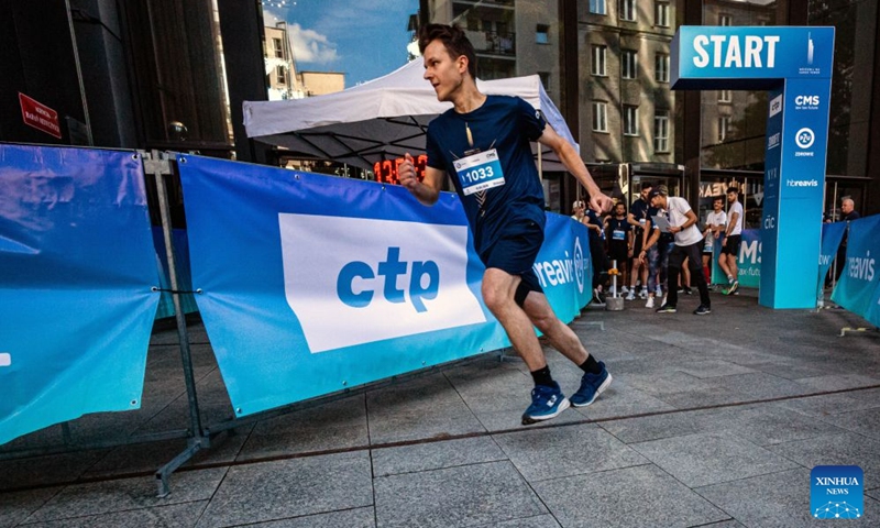 A participant runs near the starting point during the fifth edition of the Run Up Varso Tower stair-climbing race in Warsaw, Poland, Sept. 19, 2026. The event was held at Varso Tower in Warsaw on Saturday, with runners climbing almost 1,400 stairs on their way to the finish line located on the Highline Warsaw observation deck. (Photo by Jaap Arriens/Xinhua)