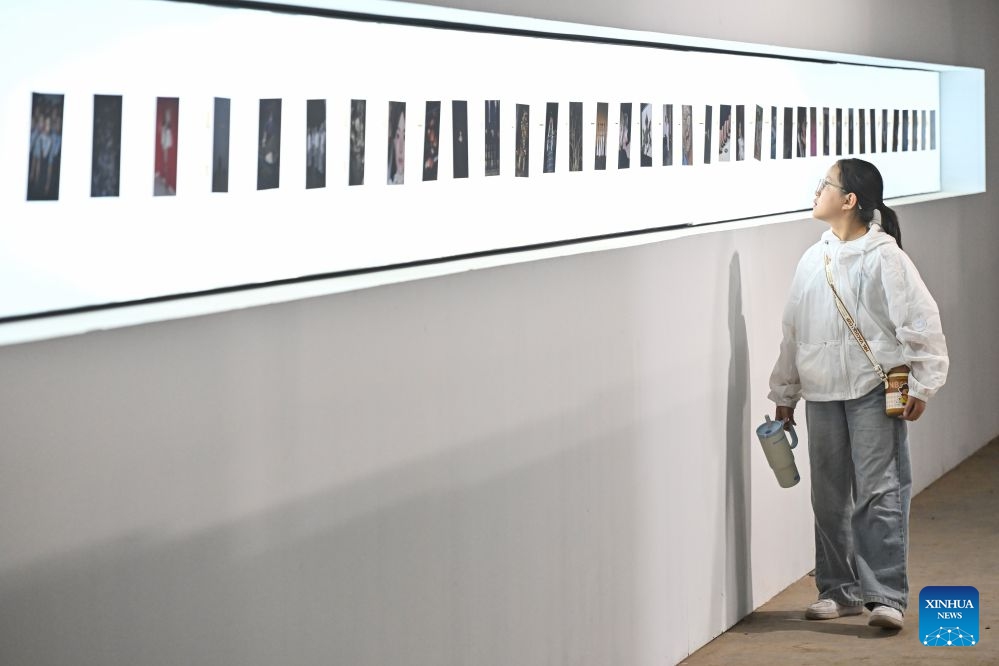 A visitor views works at the 26th Pingyao International Photography Festival (PIP) in Pingyao ancient town in Jinzhong, north China's Shanxi Province, Sept. 19, 2026. The 26th PIP kicked off here on Saturday, featuring works by more than 2,600 photographers from over 30 countries and regions. The event will run until Sept. 23. (Xinhua/Sun Ruibo)