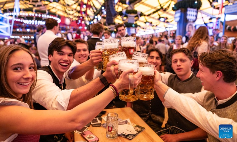 People enjoy beer at the Oktoberfest in Munich, Germany, Sept. 19, 2026. The 191st Oktoberfest, one of the largest folk festivals in Germany, opened on Saturday in Munich, with mayor Dominik Krause tapping the first barrel of beer as a tradition. This year's festival will last until Oct. 4. Photo: Xinhua