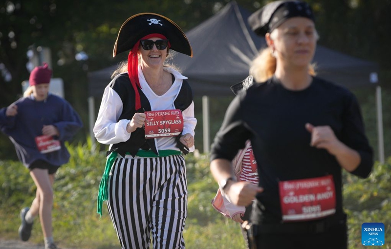 Runners dressed in pirate-themed costumes take part in the 2026 Big Pirate Run in Richmond, British Columbia, Canada, Sept. 19, 2026. Runners dressed as pirates took part in the themed event, which featured multiple race distances along trails here on Saturday. (Photo by Liang Sen/Xinhua)
