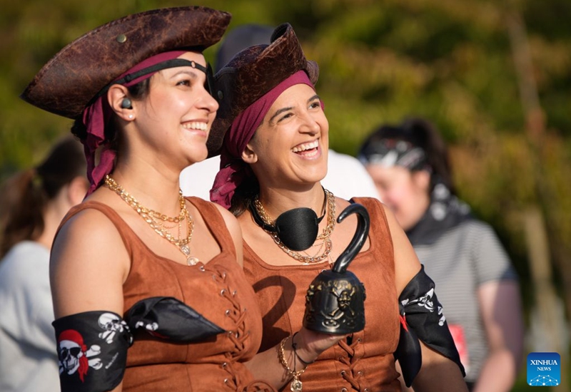 Runners dressed in pirate-themed costumes take part in the 2026 Big Pirate Run in Richmond, British Columbia, Canada, Sept. 19, 2026. Runners dressed as pirates took part in the themed event, which featured multiple race distances along trails here on Saturday. (Photo by Liang Sen/Xinhua)