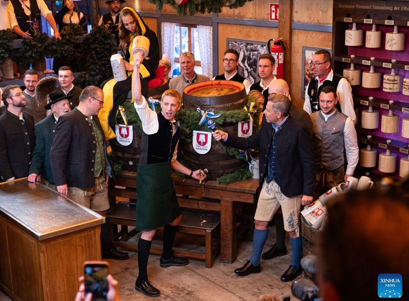 Munich Mayor Dominik Krause (C) taps the first barrel of beer of the 191st Oktoberfest in Munich, Germany, Sept. 19, 2026. The 191st Oktoberfest, one of the largest folk festivals in Germany, opened on Saturday in Munich, with mayor Dominik Krause tapping the first barrel of beer as a tradition. This year's festival will last until Oct. 4. Photo: Xinhua