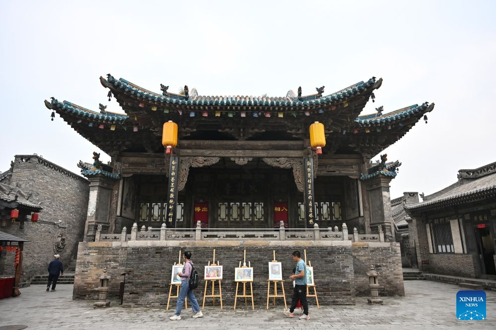 People visit the 26th Pingyao International Photography Festival (PIP) in Pingyao ancient town in Jinzhong, north China's Shanxi Province, Sept. 19, 2026. The 26th PIP kicked off here on Saturday, featuring works by more than 2,600 photographers from over 30 countries and regions. The event will run until Sept. 23. (Xinhua/Sun Ruibo)